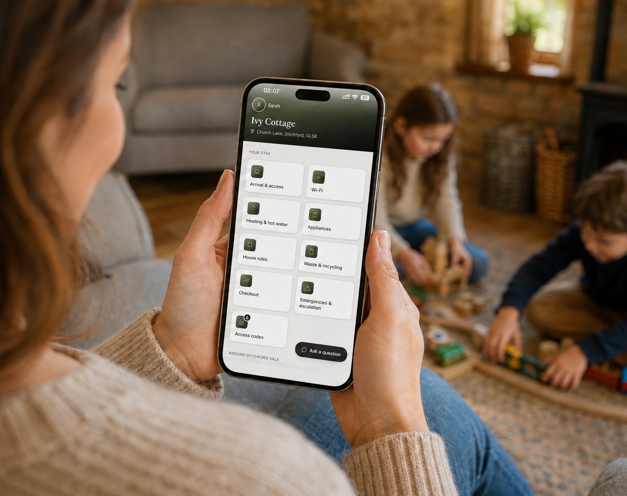 A guest checking Wi-Fi, heating and house rules for Ivy Cottage on their phone, using the Cotswold Host guest app